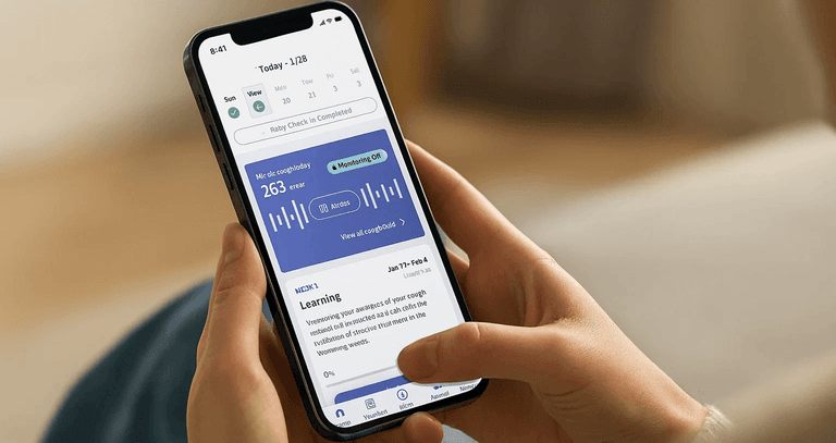 Patient using Hyfe’s digital therapeutic app for chronic cough on a smartphone